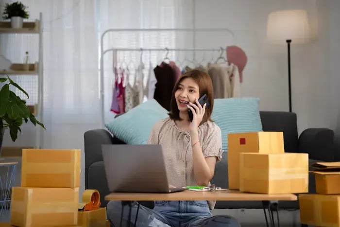 Entrepreneur handling eyewear e-commerce sales and deliveries after virtual try-on purchases.